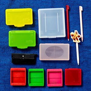 Lot of Nintendo Cases, Silicone Sleeves, Pens, and USG-005 Slot Cover